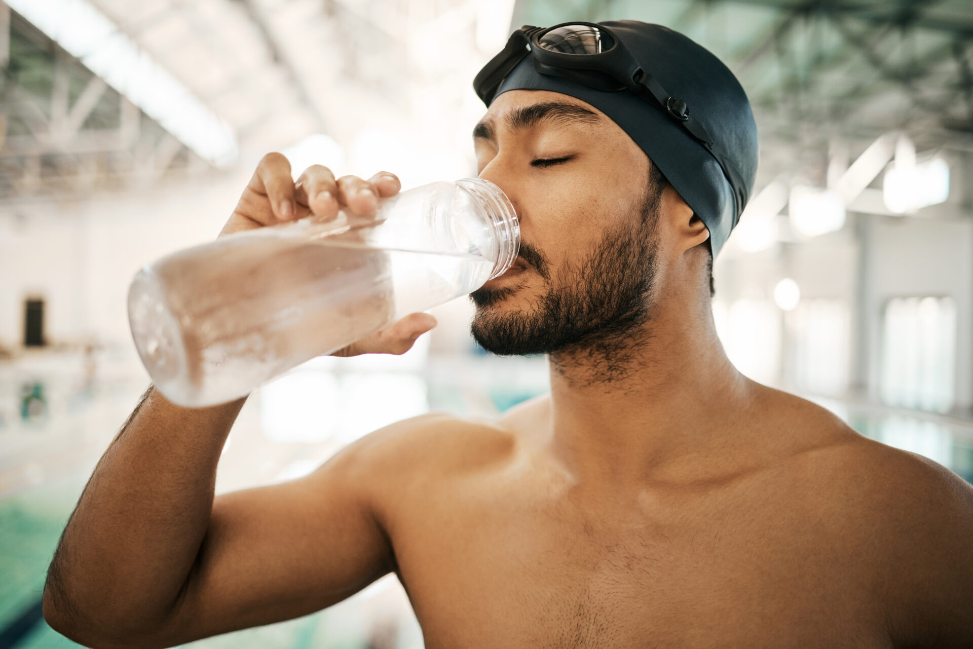 swimmer and drinking water for hydration